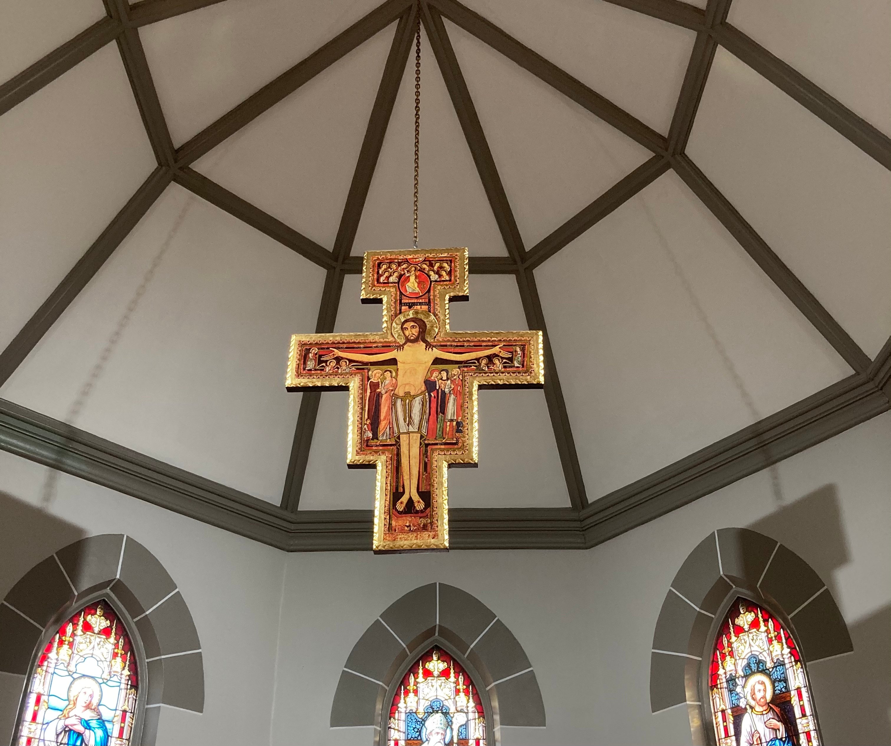 Hanging crucifix over sanctuary