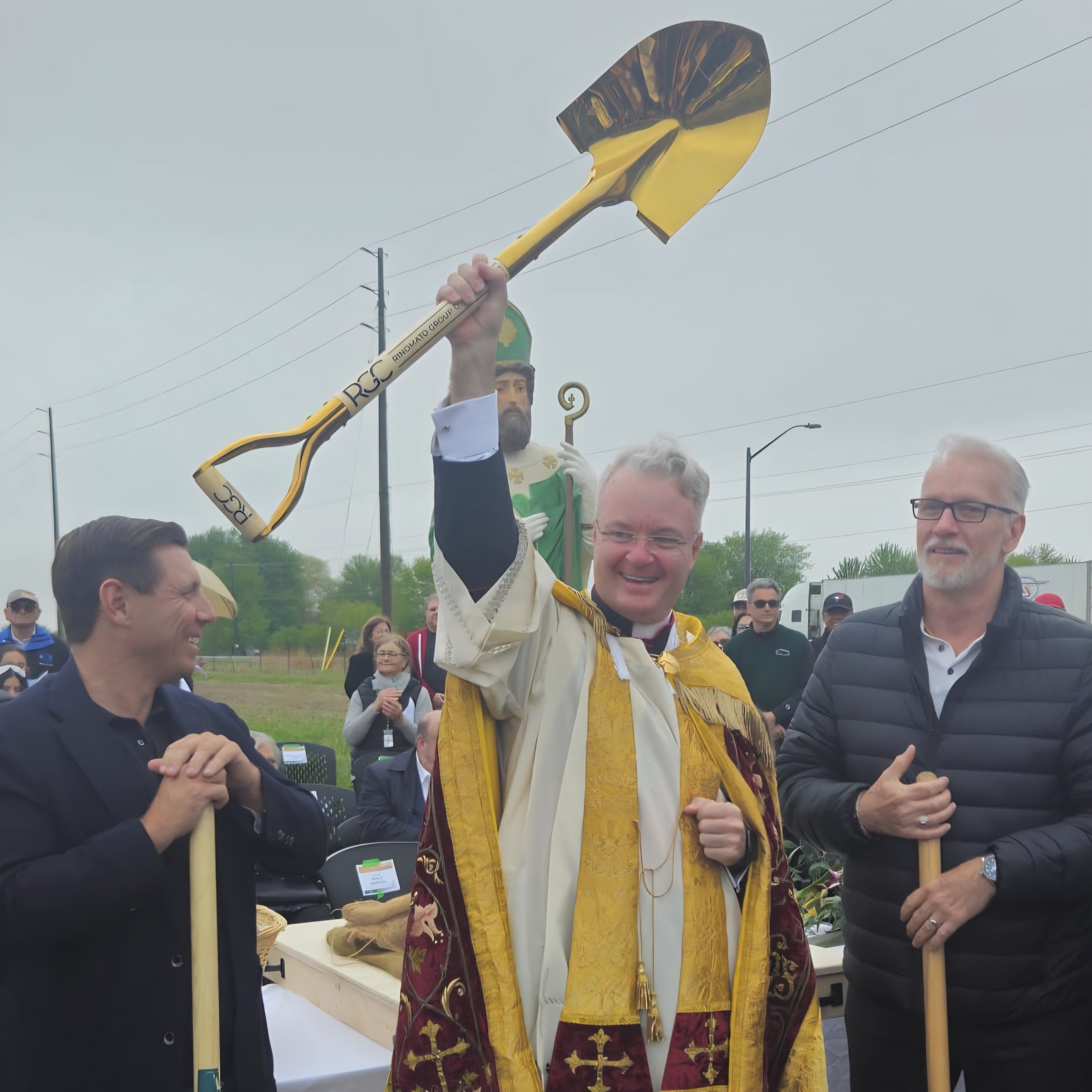Groundbreaking Event: Monsignor with shovel
